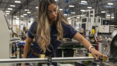 Woman works in manufacturing facility